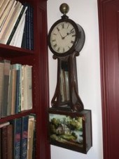 A 19th C. banjo clock with an eglomise