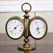 A German brass cased desk clock, barometer