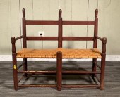 A antique red painted wagon seat/bench
