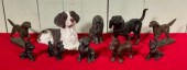 Ten metal, brass and composite dog figurines