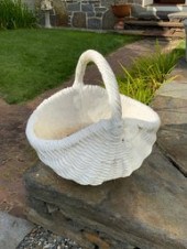 A white painted concrete handled basket
