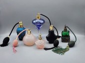 Group of 6 perfume bottles with atomizers.