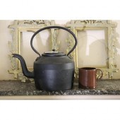 Antique cast iron kettle, along with