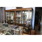 Large four door oak shop display cabinet,