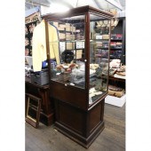 Antique shop display cabinet on panelled