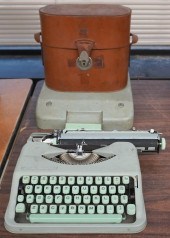 HERMES ROCKET TYPEWRITER AND A LEATHER