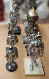 GROUP OF METAL SUITS OF ARMOR-FORM TABLE