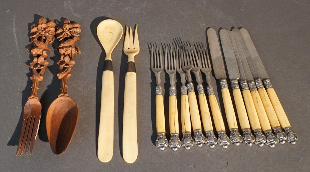 GROUP OF FLATWARE INCLUDING CARVED