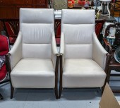 A PAIR OF CONTEMPORARY LEATHER ARMCHAIRS