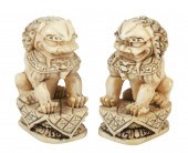Pair of Chinese ivory foo lion figurines,