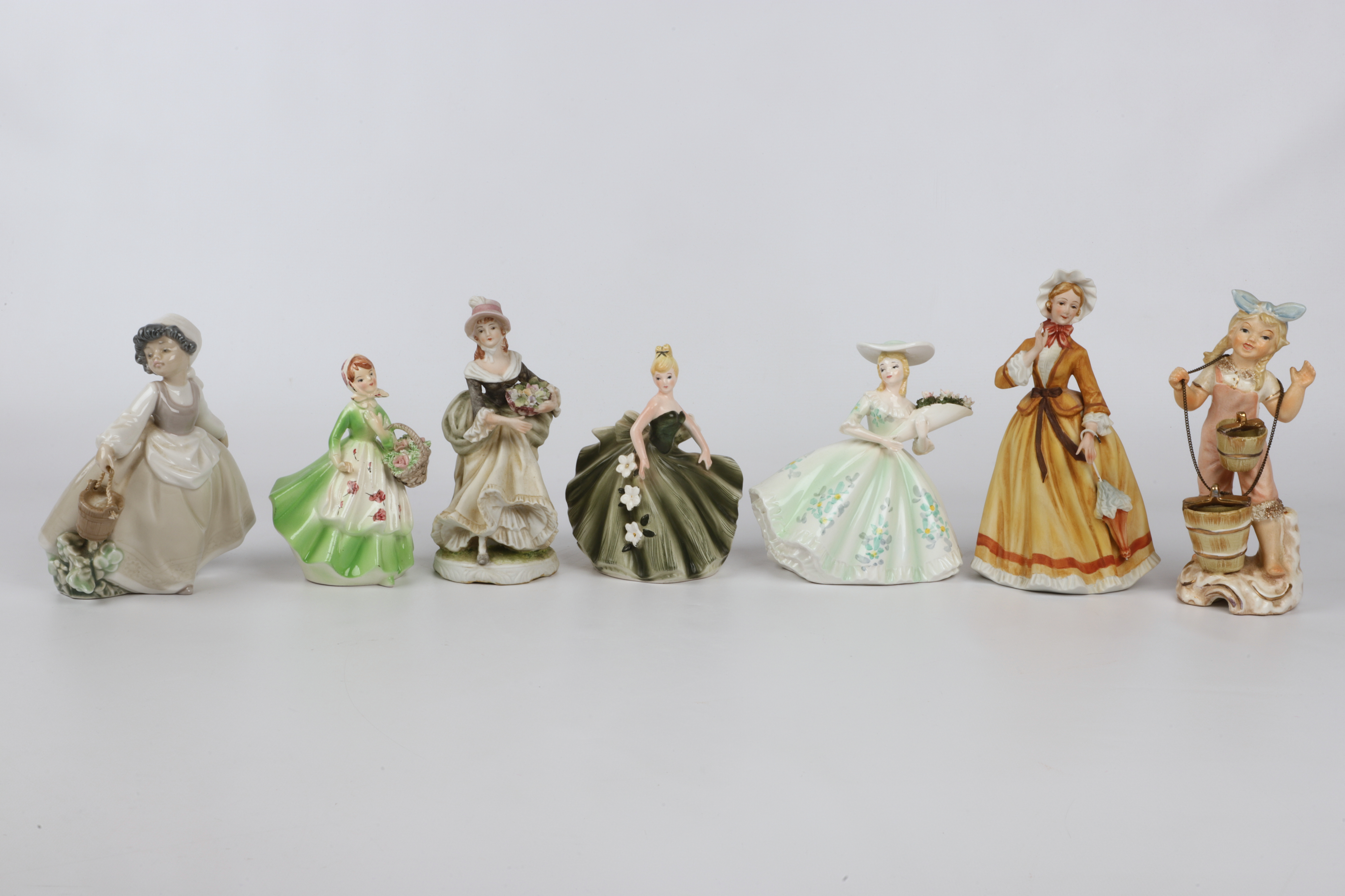  7 Porcelain female figurines  3ca80e