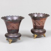 PAIR OF COPPER AND BRASS THREE-FOOTED