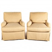 A PAIR OF SWIVEL UPHOLSTERED ARMCHAIRS,