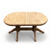 A TWIN PEDESTAL PINE DINING TABLE. More