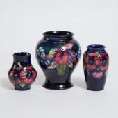 Two Moorcroft Pansy Vases and an Orchids