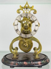 A CONTINENTAL BRASS SKELETON CLOCK RETAILED
