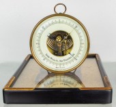 A GERMAN BRASS TABLE-TOP BAROMETER RETAILED