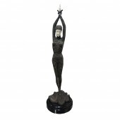 A CONTINENTAL PATINATED BRONZE FIGURE