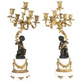 A PAIR OF LOUIS XV STYLE GILT AND PATINATED