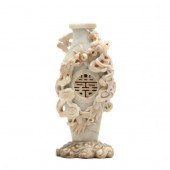 A CHINESE CARVED SOAPSTONE VASE WITH