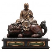 A JAPANESE LACQUERED AND GILT WOOD CARVING