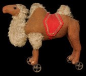 AN EARLY STEIFF CAMEL PULL TOY ON IRON