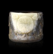 CHINESE JADE CARVED ARCHER RING, 17TH
