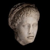A Roman Marble Head of a Youth Wearing