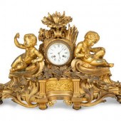 A Napoleon III Gilt Bronze Mantel Clock
By