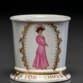 A Porcelain Shaving Mug Depicting a