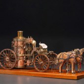 A Copper and Wood Horse-Drawn Steam-Powered
