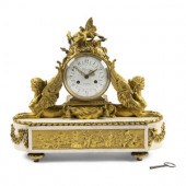 An Empire Gilt Bronze and Marble Mantel