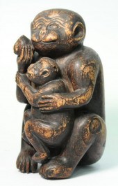 CARVED WOOD SCULPTURE OF A MONKEY, INFANT