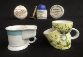 Lot including two mustache cups