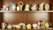 TWO SHELVES OF HULL POTTERY Two