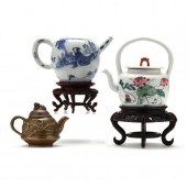 A COLLECTION OF THREE CHINESE TEAPOTS