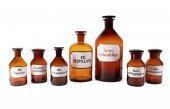 SEVEN AMBER GLASS APOTHECARY BOTTLES
